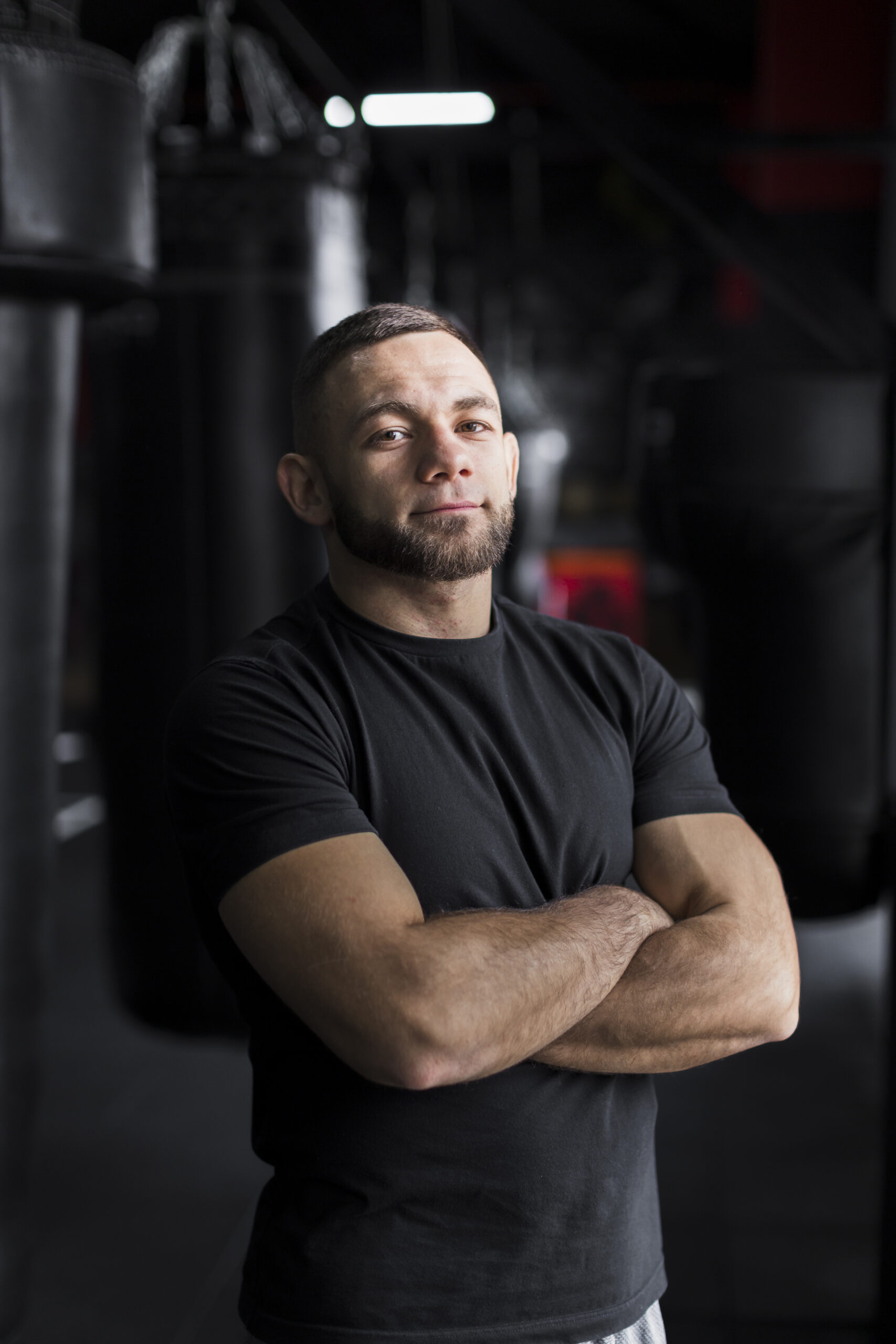 male boxer posing t shirt with arms crossed